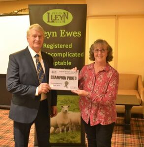 AGM 2022 - Edward Adamson collects the Champion Prize card for the Photos Competition from Mandy Fort.JPG